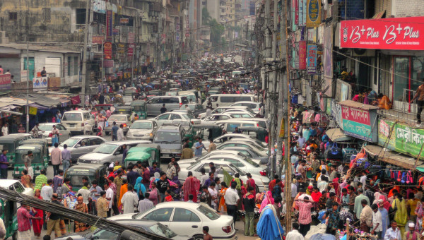 Dhaka (Bangladesh) traffic has been called one of the 7 wonders of the modern world. To be fair, this is a street adjacent to New Market and isn't really a normal traffic road. For example, rickshaws are prohibited. Bangladesh has been promoting the use of natural gas (CNG) for over a decade resulting in significant reduction in smog.